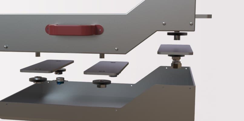 The wax tray drawer with its handle, shown above the heating elements and the thermostats that sit under it.