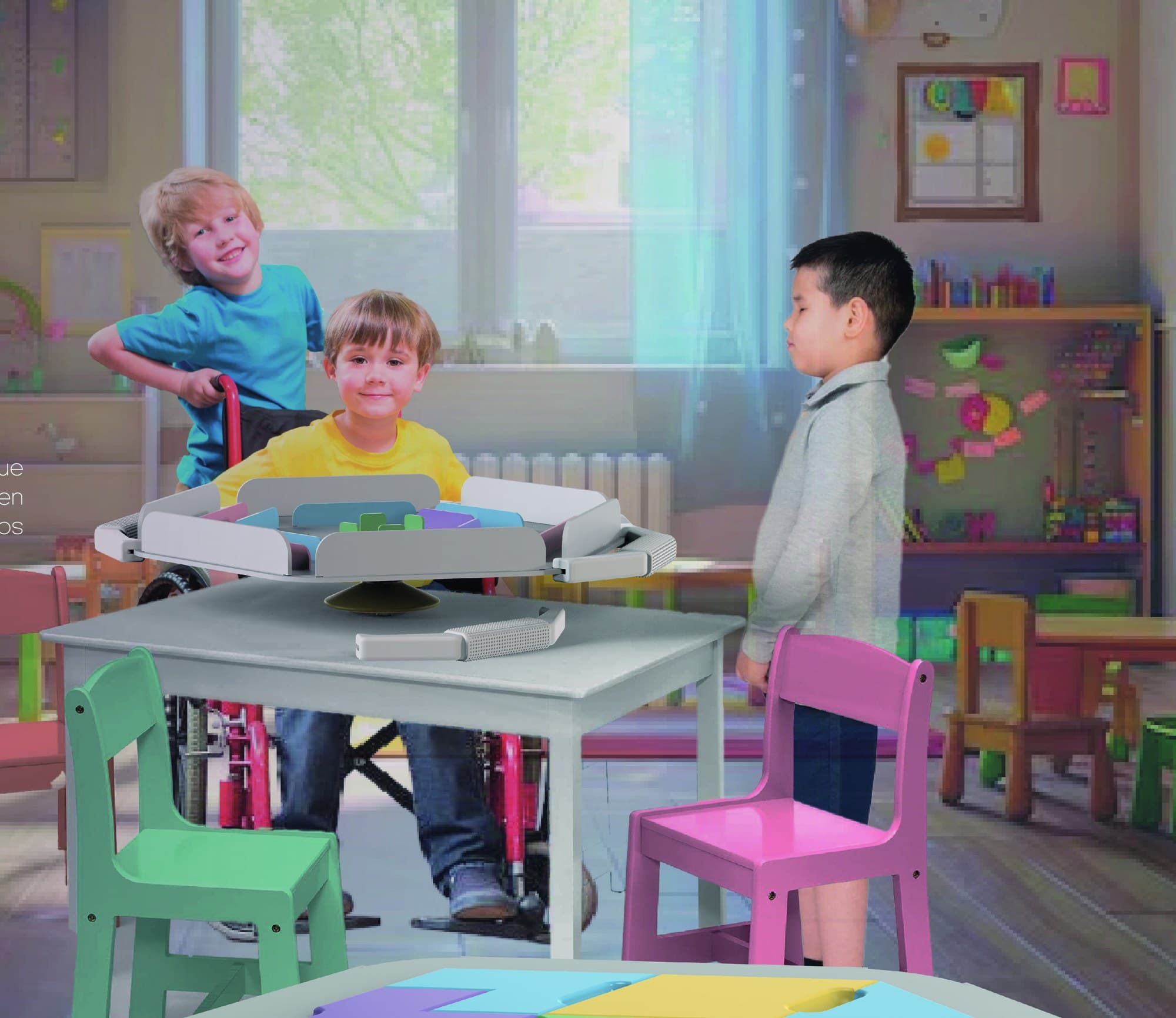 Three children around a classroom table with the jugaremos board on it. One plays from a wheelchair, another leans on the chair beside him and a third watches from the far side.