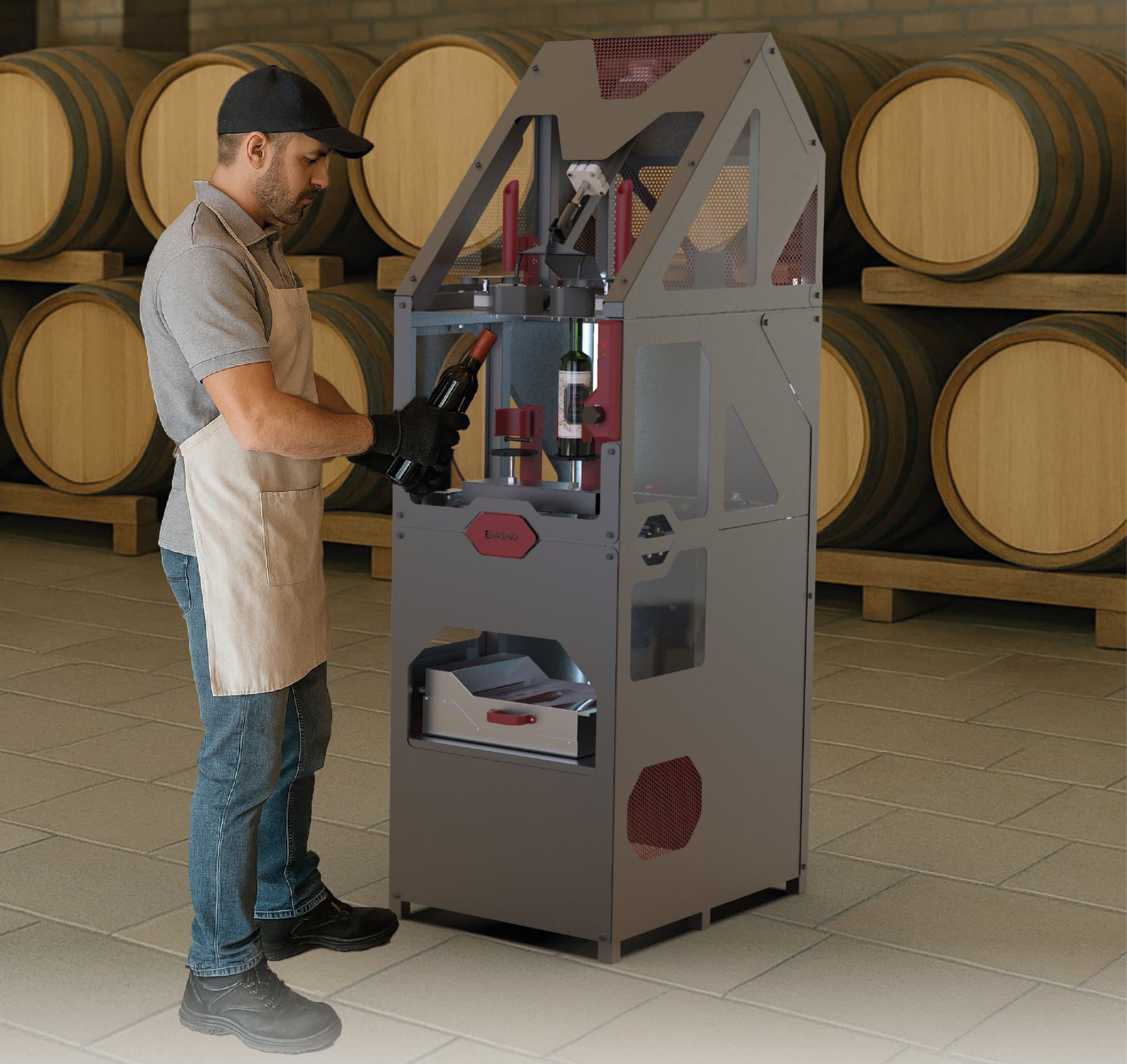 An operator loading a bottle into the envino machine in a winery, with oak barrels behind.